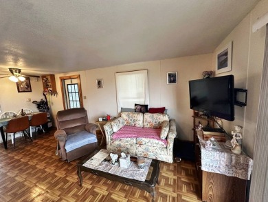 Welcome to your perfect retreat! This cozy 2 bedroom, 1 bathroom on Lake Henry Golf Club in Florida - for sale on GolfHomes.com, golf home, golf lot