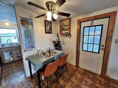 Welcome to your perfect retreat! This cozy 2 bedroom, 1 bathroom on Lake Henry Golf Club in Florida - for sale on GolfHomes.com, golf home, golf lot