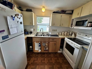 Welcome to your perfect retreat! This cozy 2 bedroom, 1 bathroom on Lake Henry Golf Club in Florida - for sale on GolfHomes.com, golf home, golf lot