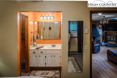 Cute Year Round Mountain Cabin.  Open floor plan with fantastic on Land Harbor Golf Course in North Carolina - for sale on GolfHomes.com, golf home, golf lot