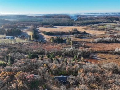 Timeless elegance abounds in this custom-built home nestled on 2 on Chippewa Valley Golf Club in Wisconsin - for sale on GolfHomes.com, golf home, golf lot