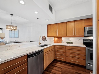 Sweeping bay views and refined comfort define this beautifully on Longboat Key Golf Club Resort in Florida - for sale on GolfHomes.com, golf home, golf lot