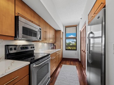 Sweeping bay views and refined comfort define this beautifully on Longboat Key Golf Club Resort in Florida - for sale on GolfHomes.com, golf home, golf lot