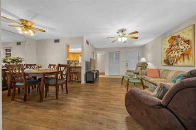 Lake Sparkle 55+ FURNISHED LAKEFRONT 1st FLOOR Condominium on Country Club At Silver Springs Shores in Florida - for sale on GolfHomes.com, golf home, golf lot