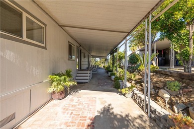 Charming golf course home located in the Canyon Lake Mobile on Canyon Lake Country Club in California - for sale on GolfHomes.com, golf home, golf lot