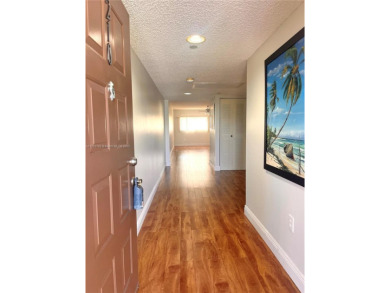 IMPECCABLE UNIT IN THE HEART OF PEMBROKE PINES, RESORT STYLE!! on Flamingo Lakes Country Club in Florida - for sale on GolfHomes.com, golf home, golf lot