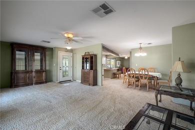 Charming golf course home located in the Canyon Lake Mobile on Canyon Lake Country Club in California - for sale on GolfHomes.com, golf home, golf lot