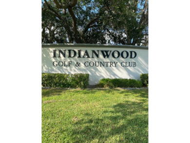 Discover the perfect blend of comfort and active living in this on Indianwood Golf and Country Club in Florida - for sale on GolfHomes.com, golf home, golf lot