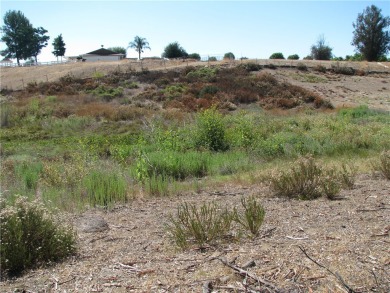 This 6.77 acre parcel is a flag lot located on the east side of on Bear Creek Golf and Country Club in California - for sale on GolfHomes.com, golf home, golf lot