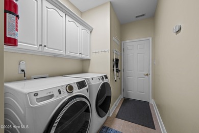 Welcome to this stunning brick and vinyl home nestled in the on Harbour Point Golf Club in North Carolina - for sale on GolfHomes.com, golf home, golf lot