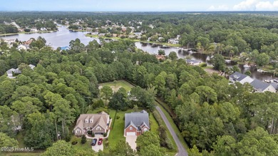 Welcome to this stunning brick and vinyl home nestled in the on Harbour Point Golf Club in North Carolina - for sale on GolfHomes.com, golf home, golf lot