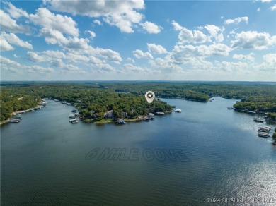 One of 6 Mile Cove's finest waterfront estates situated on 200 on Tan-Tar-A Golf Club in Missouri - for sale on GolfHomes.com, golf home, golf lot