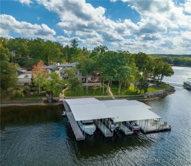 One of 6 Mile Cove's finest waterfront estates situated on 200 on Tan-Tar-A Golf Club in Missouri - for sale on GolfHomes.com, golf home, golf lot