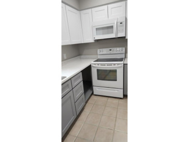 Ground level condo overlooking pool and fairwaypletely painted on Rockport Country Club in Texas - for sale on GolfHomes.com, golf home, golf lot