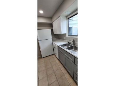 Ground level condo overlooking pool and fairwaypletely painted on Rockport Country Club in Texas - for sale on GolfHomes.com, golf home, golf lot
