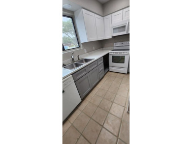 Ground level condo overlooking pool and fairwaypletely painted on Rockport Country Club in Texas - for sale on GolfHomes.com, golf home, golf lot