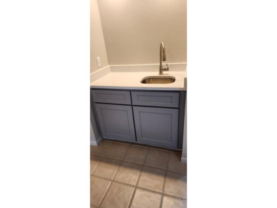 Ground level condo overlooking pool and fairwaypletely painted on Rockport Country Club in Texas - for sale on GolfHomes.com, golf home, golf lot