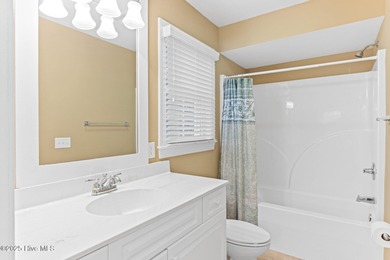 Welcome to life overlooking the first tee at Rivers Edge. Tucked on Rivers Edge Golf Club in North Carolina - for sale on GolfHomes.com, golf home, golf lot