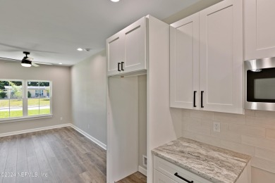 This brand new construction, split BR and open concept floor on Keystone Heights Golf and Country Club in Florida - for sale on GolfHomes.com, golf home, golf lot