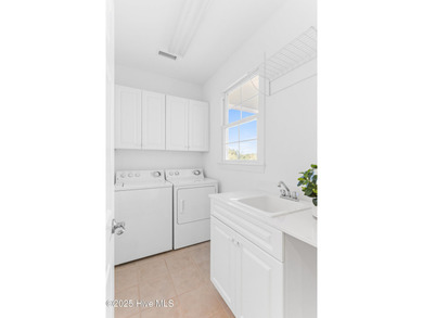 Welcome to life overlooking the first tee at Rivers Edge. Tucked on Rivers Edge Golf Club in North Carolina - for sale on GolfHomes.com, golf home, golf lot