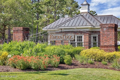 Welcome to life overlooking the first tee at Rivers Edge. Tucked on Rivers Edge Golf Club in North Carolina - for sale on GolfHomes.com, golf home, golf lot