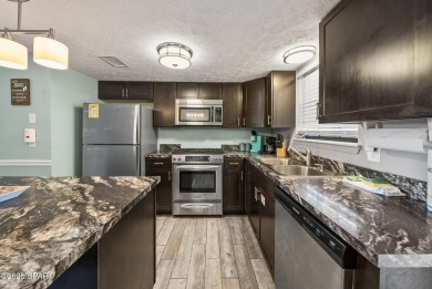 Step into beachside bliss with this newly renovated townhome in on Edgewater Beach Resort in Florida - for sale on GolfHomes.com, golf home, golf lot