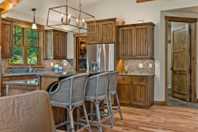 Elegant and distinctive, this Whispering Rock residence offers on Eagle Bend Golf Course in Montana - for sale on GolfHomes.com, golf home, golf lot