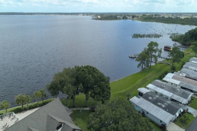 Beautiful 2009 home is just under 1700 sf. and sits on the 9th on Lake Henry Golf Club in Florida - for sale on GolfHomes.com, golf home, golf lot