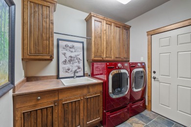 Elegant and distinctive, this Whispering Rock residence offers on Eagle Bend Golf Course in Montana - for sale on GolfHomes.com, golf home, golf lot
