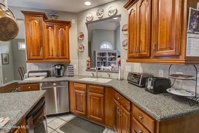 Nestled within a prestigious gated golf community, this on Brunswick Plantation and Golf Resorts in North Carolina - for sale on GolfHomes.com, golf home, golf lot