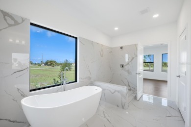 This exceptional new construction home, built by ONX Homes, is on Burnt Store Golf Club in Florida - for sale on GolfHomes.com, golf home, golf lot