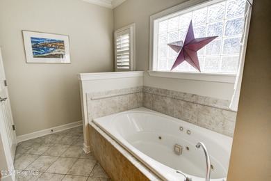 Nestled within a prestigious gated golf community, this on Brunswick Plantation and Golf Resorts in North Carolina - for sale on GolfHomes.com, golf home, golf lot