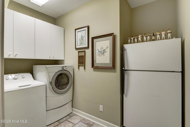 Nestled within a prestigious gated golf community, this on Brunswick Plantation and Golf Resorts in North Carolina - for sale on GolfHomes.com, golf home, golf lot