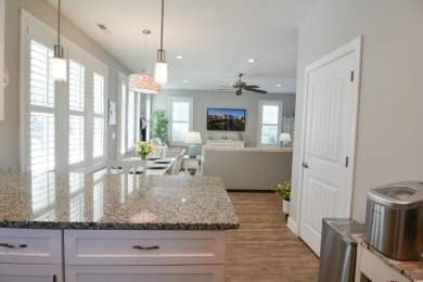 Discover coastal living at its finest in this meticulously on Barefoot Resort and Golf Club  in South Carolina - for sale on GolfHomes.com, golf home, golf lot