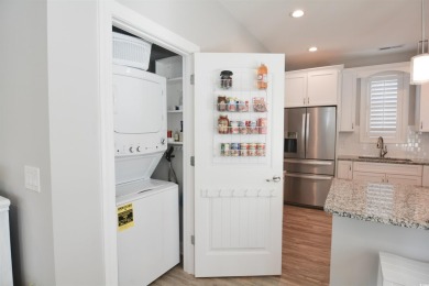 Discover coastal living at its finest in this meticulously on Barefoot Resort and Golf Club  in South Carolina - for sale on GolfHomes.com, golf home, golf lot