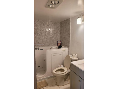 Great clean first floor unit in a quiet building with ample on Hillsboro Pines Golf in Florida - for sale on GolfHomes.com, golf home, golf lot