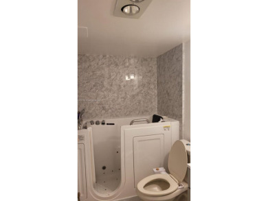 Great clean first floor unit in a quiet building with ample on Hillsboro Pines Golf in Florida - for sale on GolfHomes.com, golf home, golf lot