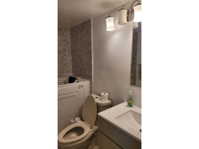 Great clean first floor unit in a quiet building with ample on Hillsboro Pines Golf in Florida - for sale on GolfHomes.com, golf home, golf lot