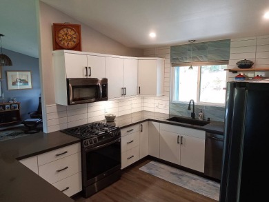 This 2022 beauty near the 18th tee with ocean and fairway views on Discovery Harbour Golf Course in Hawaii - for sale on GolfHomes.com, golf home, golf lot