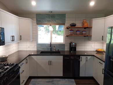This 2022 beauty near the 18th tee with ocean and fairway views on Discovery Harbour Golf Course in Hawaii - for sale on GolfHomes.com, golf home, golf lot