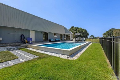 Step into effortless Florida living at this beautifully on Tiger Point Golf and Country Club in Florida - for sale on GolfHomes.com, golf home, golf lot