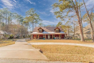 This stunning Satterwhite log home offers 2,550 square feet of on Hide-A-Way Lake Golf Course in Texas - for sale on GolfHomes.com, golf home, golf lot