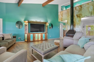 Wake up to stunning water views and a lush, private landscape in on Diamondhead Golf and Country Club in Arkansas - for sale on GolfHomes.com, golf home, golf lot