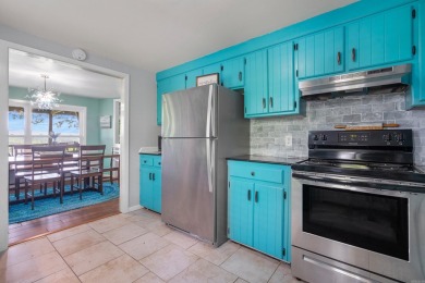 Wake up to stunning water views and a lush, private landscape in on Diamondhead Golf and Country Club in Arkansas - for sale on GolfHomes.com, golf home, golf lot