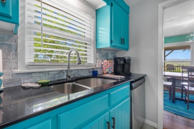 Wake up to stunning water views and a lush, private landscape in on Diamondhead Golf and Country Club in Arkansas - for sale on GolfHomes.com, golf home, golf lot