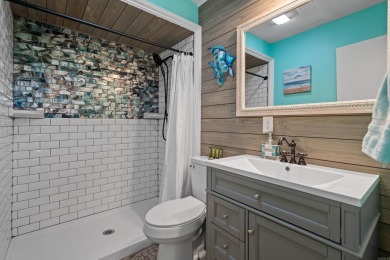 Wake up to stunning water views and a lush, private landscape in on Diamondhead Golf and Country Club in Arkansas - for sale on GolfHomes.com, golf home, golf lot