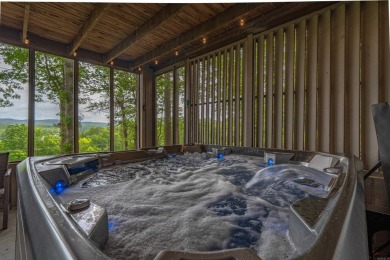 Wake up to stunning water views and a lush, private landscape in on Diamondhead Golf and Country Club in Arkansas - for sale on GolfHomes.com, golf home, golf lot