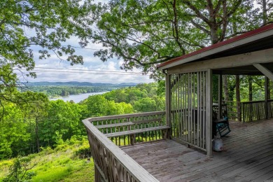Wake up to stunning water views and a lush, private landscape in on Diamondhead Golf and Country Club in Arkansas - for sale on GolfHomes.com, golf home, golf lot
