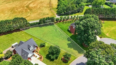 Large and cleared, gently sloping lot in Rock Barn Country Club on Rock Barn Golf and Spa in North Carolina - for sale on GolfHomes.com, golf home, golf lot
