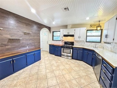 Welcome to lake life in Taylor Ferry! This super quiet on Sequoyah State Park Golf Course in Oklahoma - for sale on GolfHomes.com, golf home, golf lot